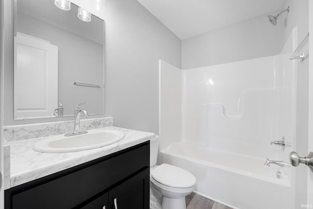 1010 Bryce Cir, Ligonier, IN 46797 - bathroom with shower / washtub combination, toilet, vanity, and wood finished floors