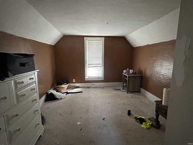 bonus room with vaulted ceiling, baseboards, and carpet