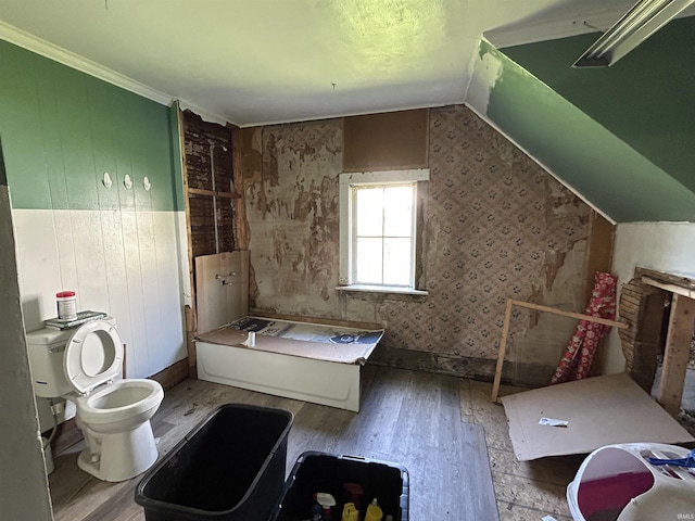 full bathroom with toilet and wood finished floors