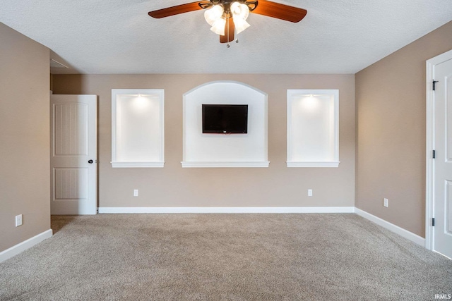3018 Caradoza Cv, Fort Wayne, IN 46825 - empty room featuring carpet floors, ceiling fan, baseboards, and a textured ceiling