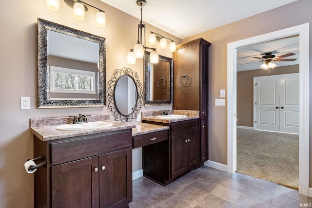 3018 Caradoza Cv, Fort Wayne, IN 46825 - bathroom featuring vanity, baseboards, ceiling fan, and tile patterned flooring