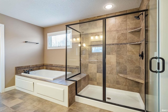3018 Caradoza Cv, Fort Wayne, IN 46825 - bathroom featuring a textured ceiling, a shower stall, and a bath