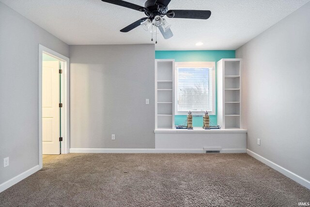 3018 Caradoza Cv, Fort Wayne, IN 46825 - carpeted empty room featuring visible vents, a ceiling fan, a textured ceiling, and baseboards