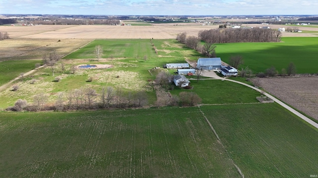 birds eye view of property with a rural view