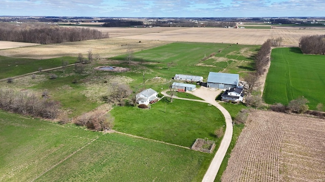 birds eye view of property with a rural view