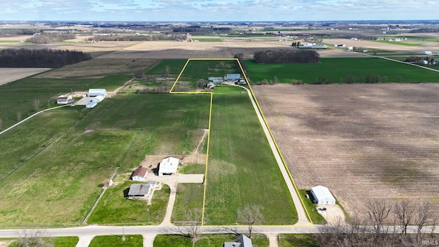 birds eye view of property featuring a rural view