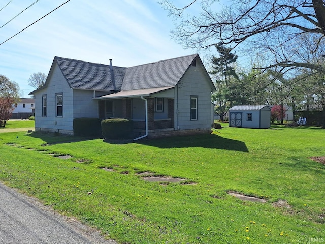 view of side of property with a storage shed, a yard, a shingled roof, and an outdoor structure