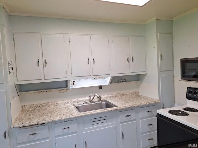kitchen featuring white cabinets, a sink, electric stove, and crown molding
