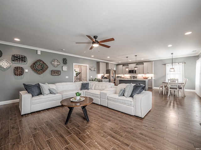 living room with recessed lighting, crown molding, dark wood-type flooring, and a ceiling fan