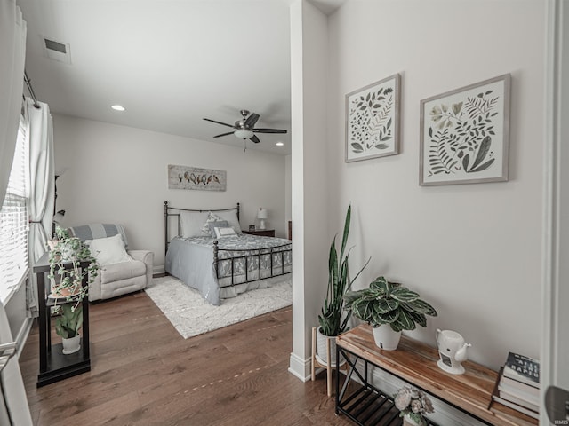 bedroom featuring baseboards, visible vents, recessed lighting, wood finished floors, and ceiling fan