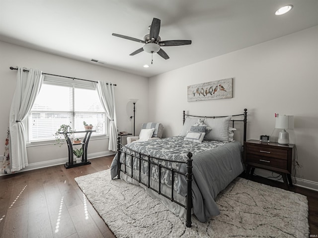 bedroom with a ceiling fan, wood-type flooring, baseboards, visible vents, and recessed lighting