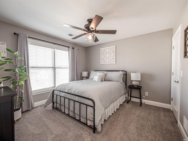 bedroom with visible vents, carpet flooring, baseboards, and ceiling fan