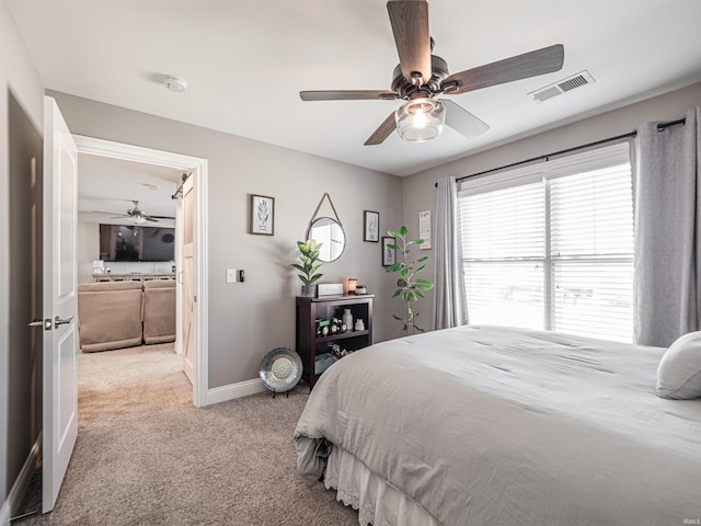 bedroom featuring baseboards, visible vents, carpet, and ceiling fan