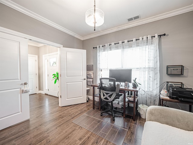 home office featuring wood finished floors, visible vents, and crown molding