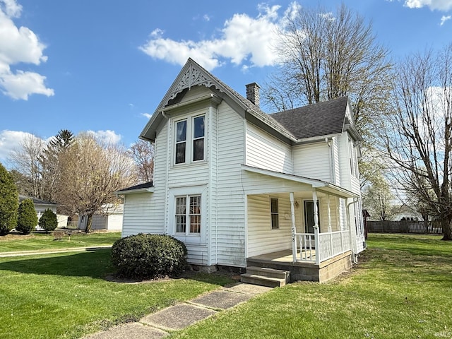 508 E Michigan St, Lagrange, IN 46761 - exterior space featuring a porch, a chimney, roof with shingles, and a front yard