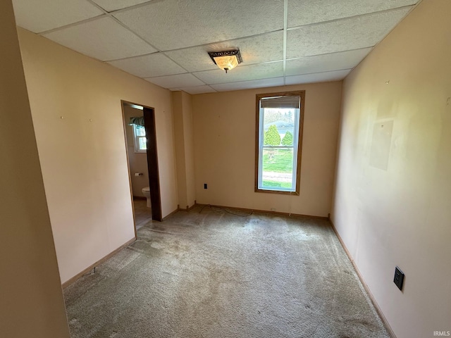 508 E Michigan St, Lagrange, IN 46761 - carpeted spare room featuring baseboards, a healthy amount of sunlight, and a drop ceiling