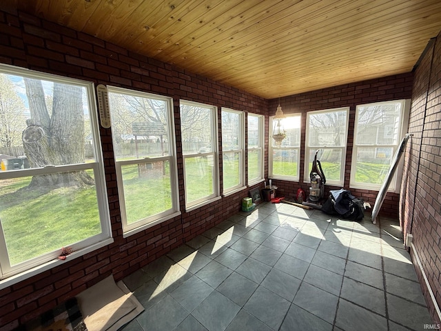 508 E Michigan St, Lagrange, IN 46761 - sunroom / solarium featuring tile patterned floors, wood ceiling, and brick wall
