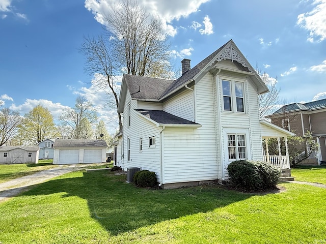 508 E Michigan St, Lagrange, IN 46761 - view of property exterior with a yard, an outbuilding, and a chimney