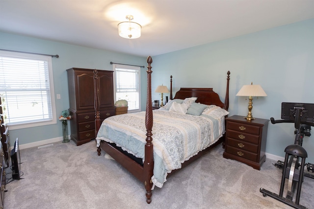 carpeted bedroom with baseboards