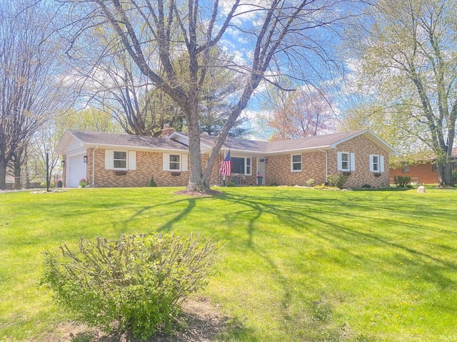 4405 Parkwood Dr, Kokomo, IN 46901 - ranch-style house featuring brick siding, a chimney, a front yard, and a garage