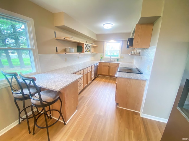 4405 Parkwood Dr, Kokomo, IN 46901 - kitchen with a peninsula, open shelves, dishwasher, a sink, and light wood-type flooring