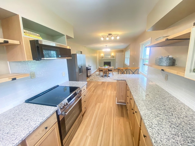 4405 Parkwood Dr, Kokomo, IN 46901 - kitchen with open shelves, stainless steel appliances, light wood-style floors, and decorative backsplash