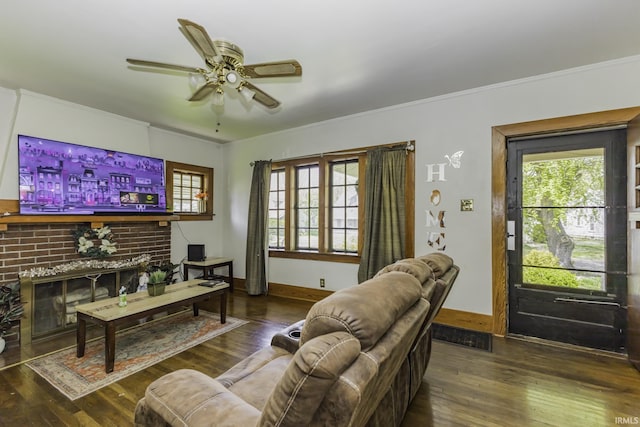 living area with ceiling fan, a wealth of natural light, and hardwood / wood-style floors