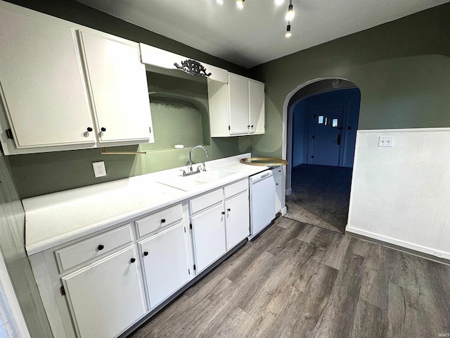 2747 Washington Ave, Bedford, IN 47421 - kitchen with dark wood-type flooring, arched walkways, white cabinets, a sink, and dishwasher