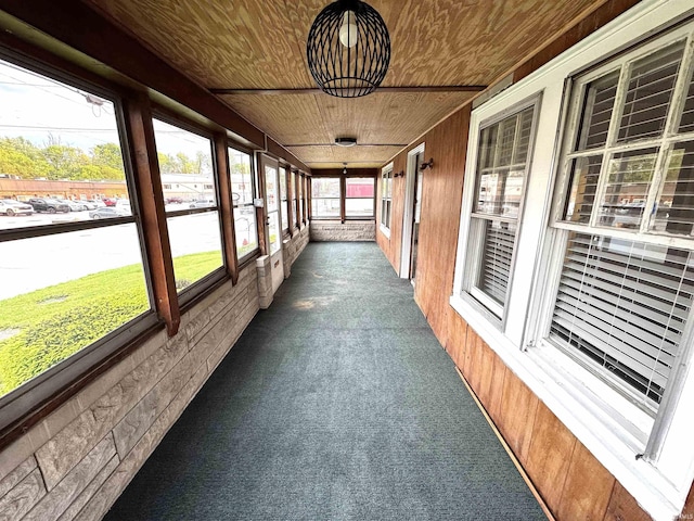 2747 Washington Ave, Bedford, IN 47421 - unfurnished sunroom with carpet floors, wood walls, and wooden ceiling