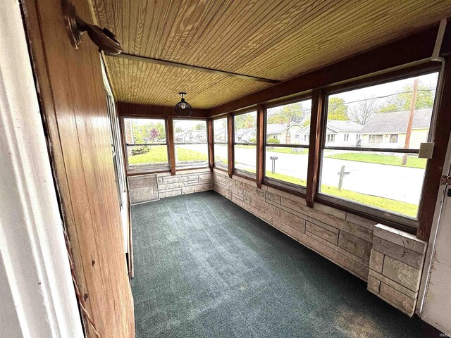 2747 Washington Ave, Bedford, IN 47421 - unfurnished sunroom featuring wooden ceiling, carpet flooring, and wood walls