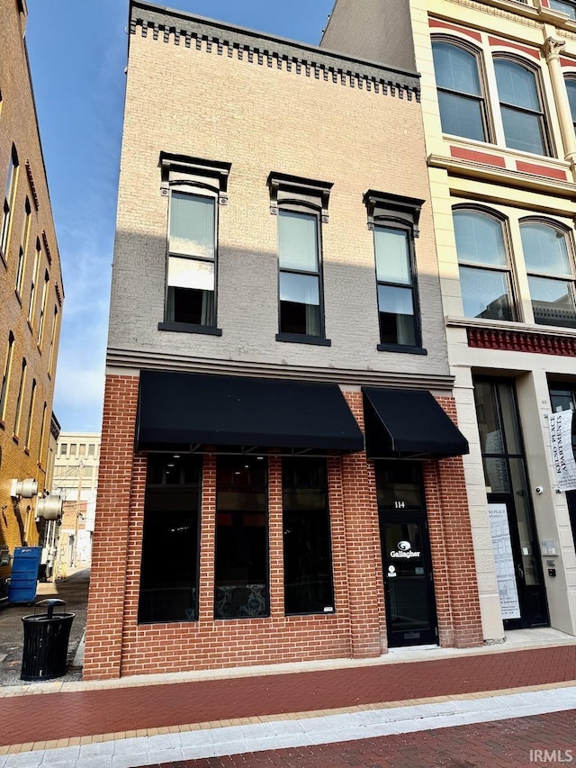 view of front of house featuring brick siding