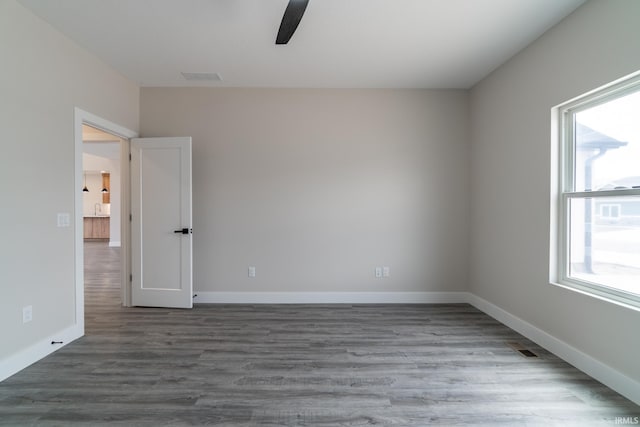 619 Sandringham Pass, Fort Wayne, IN 46845 - empty room with baseboards, visible vents, wood finished floors, and ceiling fan