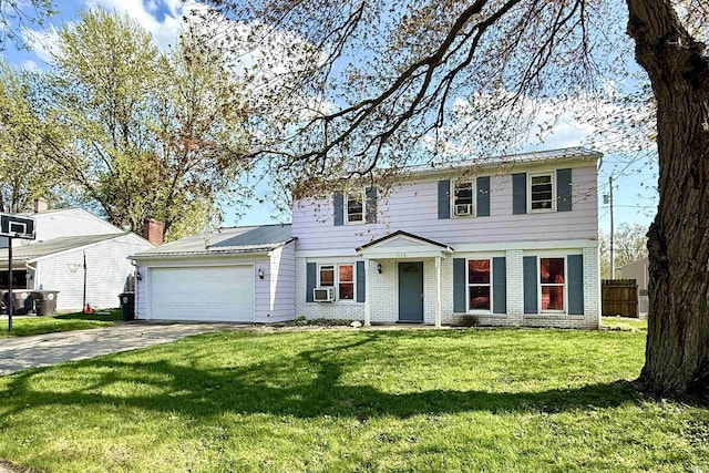 5126 Martinique Rd, Fort Wayne, IN 46815 - colonial home with a front lawn, cooling unit, driveway, an attached garage, and fence