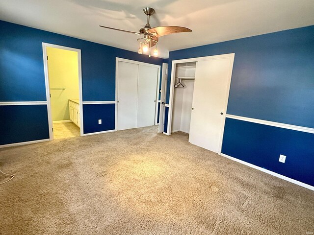 5126 Martinique Rd, Fort Wayne, IN 46815 - unfurnished bedroom with ceiling fan, baseboards, carpet floors, and ensuite bathroom