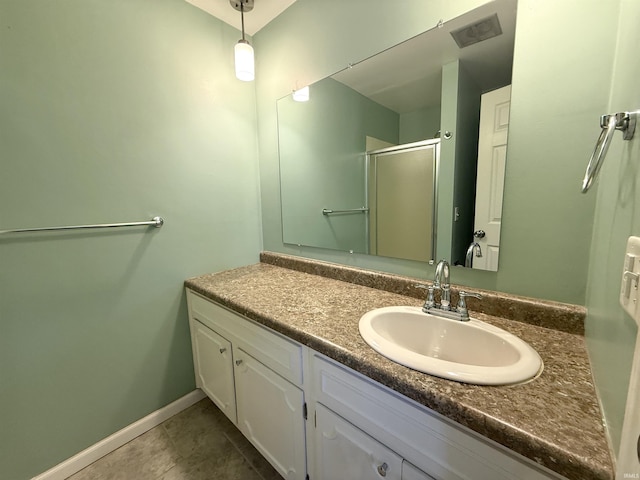 5126 Martinique Rd, Fort Wayne, IN 46815 - bathroom featuring tile patterned flooring, vanity, baseboards, visible vents, and a stall shower