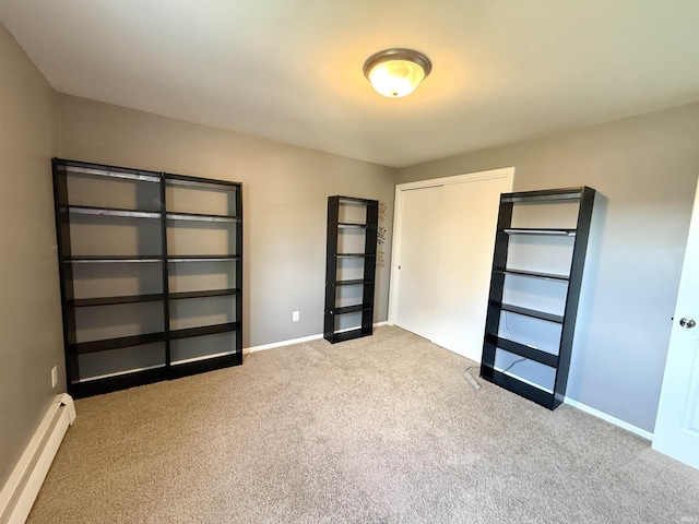 5126 Martinique Rd, Fort Wayne, IN 46815 - unfurnished bedroom featuring a baseboard radiator, a closet, carpet flooring, and baseboards