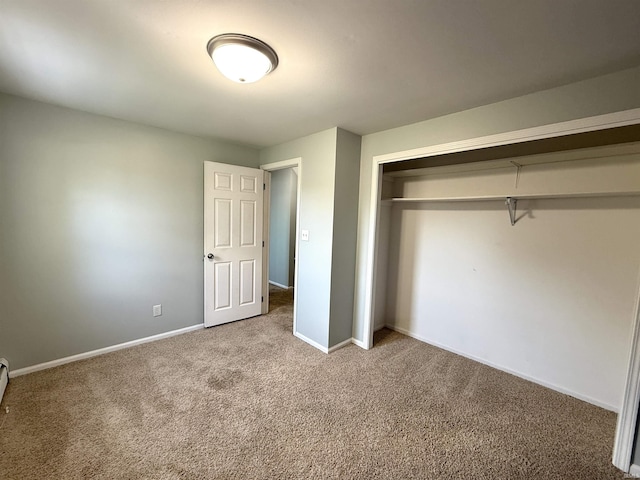 5126 Martinique Rd, Fort Wayne, IN 46815 - unfurnished bedroom featuring baseboards, a closet, and carpet flooring