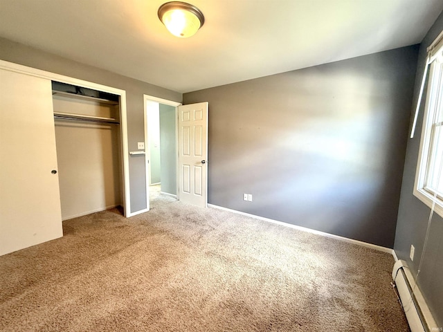 5126 Martinique Rd, Fort Wayne, IN 46815 - unfurnished bedroom featuring a closet, carpet flooring, baseboard heating, and baseboards
