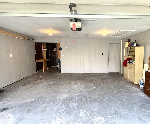 5126 Martinique Rd, Fort Wayne, IN 46815 - garage with a garage door opener and wooden walls