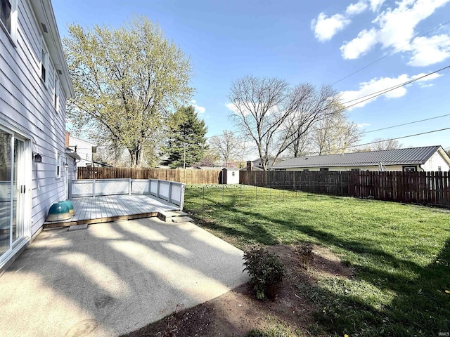 5126 Martinique Rd, Fort Wayne, IN 46815 - view of yard featuring a deck, a fenced backyard, an outdoor structure, a storage unit, and a patio