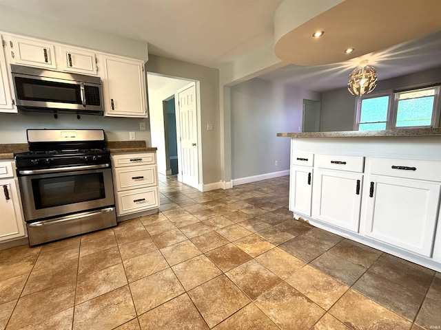 5126 Martinique Rd, Fort Wayne, IN 46815 - kitchen featuring white cabinets, appliances with stainless steel finishes, dark countertops, baseboards, and recessed lighting