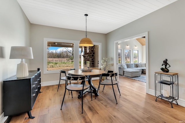 1152 Cascata Trl, Huntertown, IN 46748 - dining space featuring baseboards, light wood-style floors, and wood ceiling