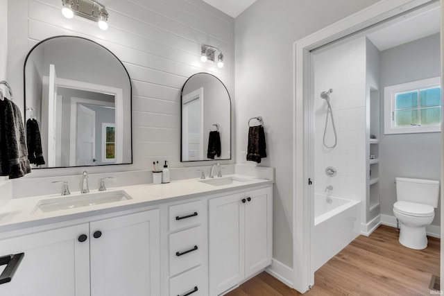 1152 Cascata Trl, Huntertown, IN 46748 - bathroom with double vanity, wood finished floors, toilet, and a sink