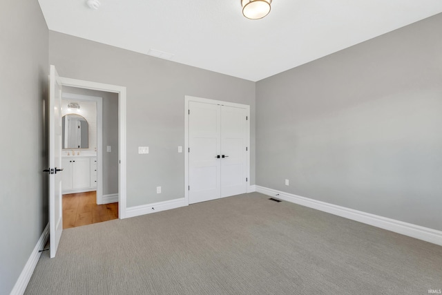 1152 Cascata Trl, Huntertown, IN 46748 - unfurnished bedroom with visible vents, a closet, baseboards, and carpet floors
