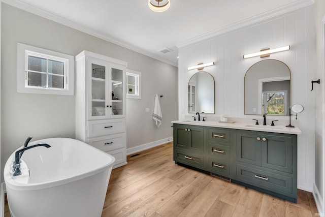 1152 Cascata Trl, Huntertown, IN 46748 - full bath featuring wood finished floors, double vanity, crown molding, and a sink