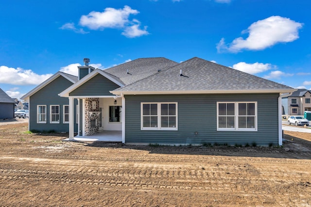 1152 Cascata Trl, Huntertown, IN 46748 - rear view of property with roof with shingles, a chimney, and a patio area