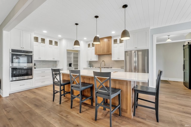 1152 Cascata Trl, Huntertown, IN 46748 - kitchen with recessed lighting, stainless steel appliances, light wood-type flooring, backsplash, and light countertops