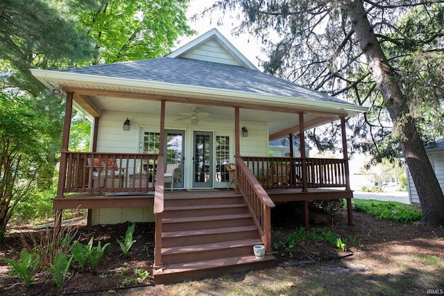 826 College Ave, Culver, IN 46511 - back of property with a shingled roof and a ceiling fan