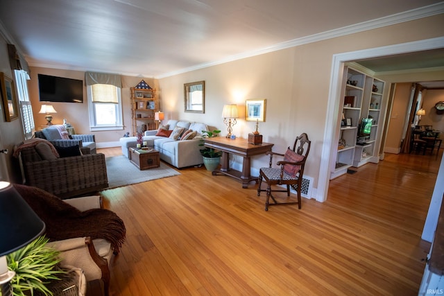 826 College Ave, Culver, IN 46511 - living room featuring ornamental molding, light wood-style flooring, built in features, and baseboards