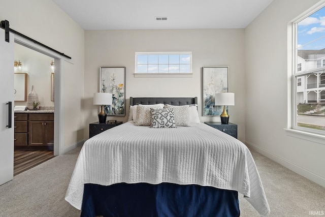 138 Parkerwood Ln, West Lafayette, IN 47906 - carpeted bedroom featuring a barn door, visible vents, and multiple windows